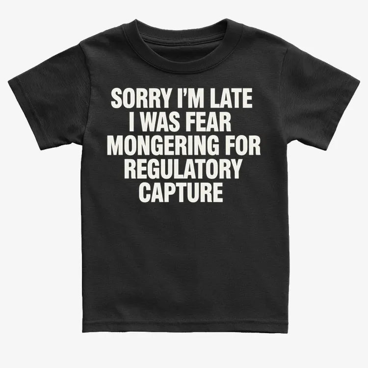 SORRY I’M LATE, I WAS FEAR MONGERING FOR REGULATORY CAPTURE-Kids T-Shirt-Black